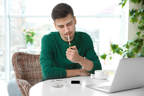 Man being treated for smoking addiction online therapy Canada